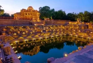 The beautiful illuminated architecture of the ancient Modhera Sun Temple at night, featured on the 10 Days South Gujarat Travel Itinerary.