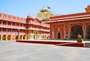The grand courtyards and magnificent Rajput architecture of the Jaipur City Palace, featured on the 19 Days Gujarat and Rajasthan Tour.