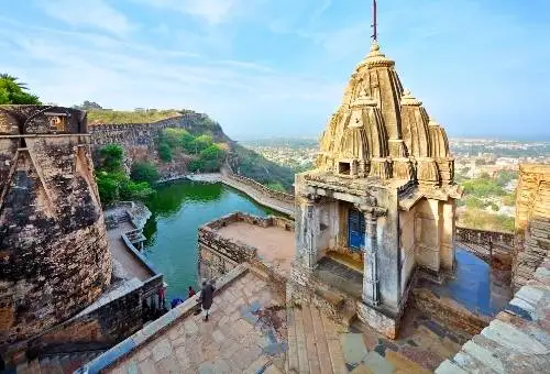 The intricately carved ancient temple architecture inside Chittorgarh Fort, a premier historic destination on our Udaipur day trips.