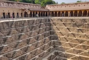 The perfectly symmetrical 13-story stone steps of the Chand Baori stepwell in Rajasthan, explored during a same-day Abhaneri heritage trip from Agra.