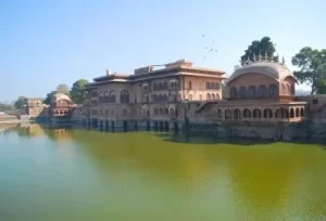The stunning 18th-century architecture and reflecting pools of the Deeg Water Palace, explored during a same-day heritage and nature tour from Agra.