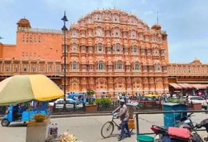 The intricate pink sandstone facade and hundreds of small windows of the Hawa Mahal, explored during a same-day Jaipur trip from Agra.