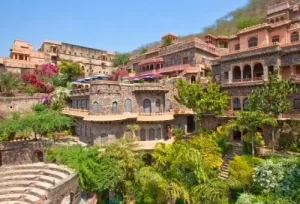 Restored courtyards and ancient architecture inside the 15th-century Neemrana Fort Palace complex, explored during a heritage day trip from Delhi.