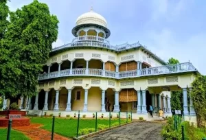 The grand two-story colonial architecture of the Anand Bhawan Museum, the historic ancestral home of the Nehru family, explored during a same-day Prayagraj heritage tour from Varanasi.